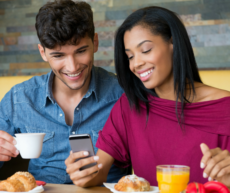 Look at this partner. A Uzbek couple is looking at the Phone. A couple is looking at the Phone. Networking during the Breakfast with CEO.