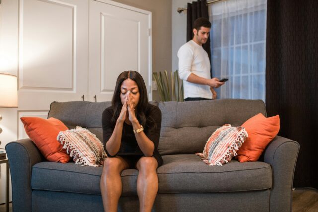 discernment counseling in virginia A man and woman experiencing emotional turmoil and separation in a living room setting.