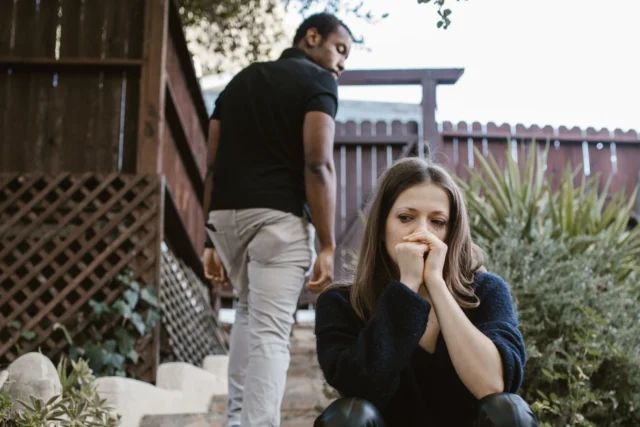 discernment counseling in virginia A couple facing emotional struggles captured in an outdoor setting.